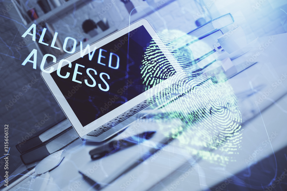 Fototapeta premium Computer on desktop in office with finger print drawing. Double exposure. Concept of business data security.