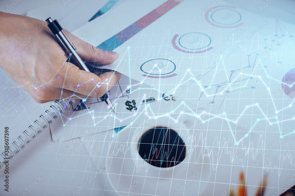 Multi exposure of man planing investment with stock market forex chart.