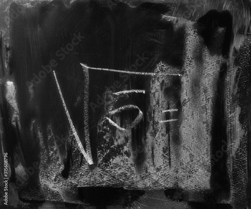 Black chalkboard, blackboard with chalk mathematical equation, square root background and texture