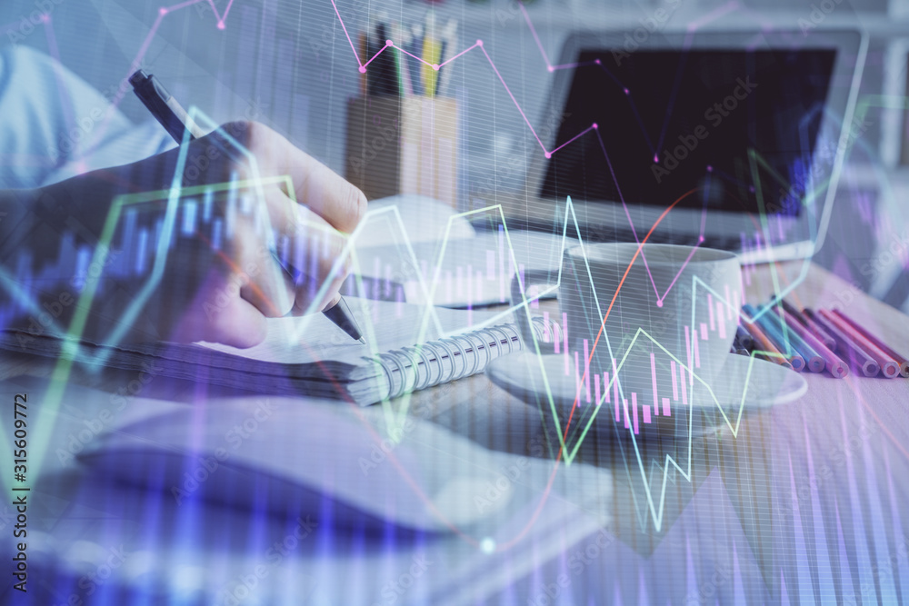 Financial chart drawn over hands taking notes background. Concept of research. Double exposure