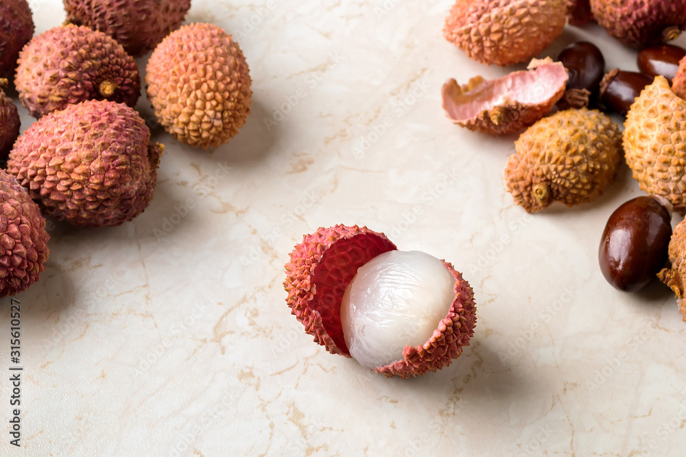 Whole lychee, shells and bones near half peeled lychee fruit (Litchi