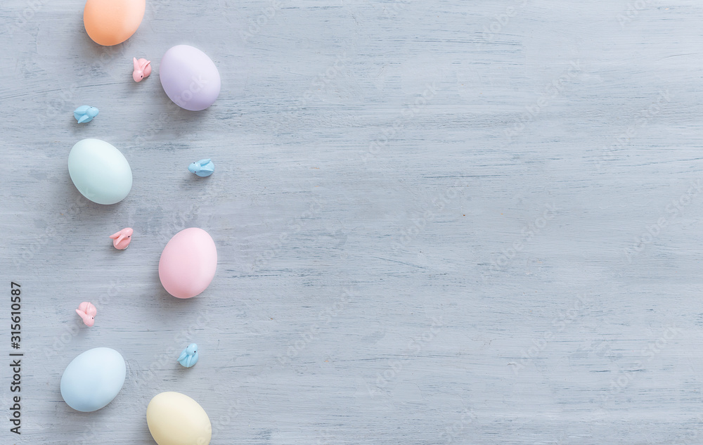 decorative easter eggs on a light wooden background. Easter-themed background with place for text