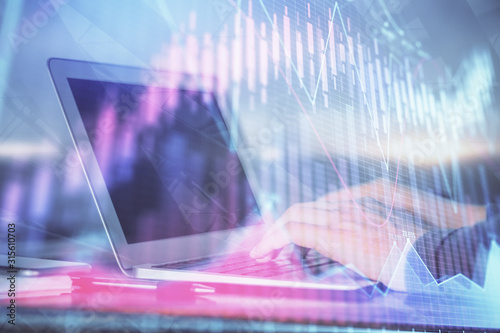 Double exposure of stock market graph with man working on laptop on background. Concept of financial analysis.