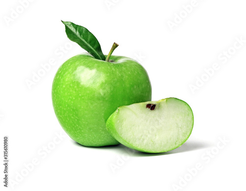 Green ripe apple with green leaf and slice isolated on a white background