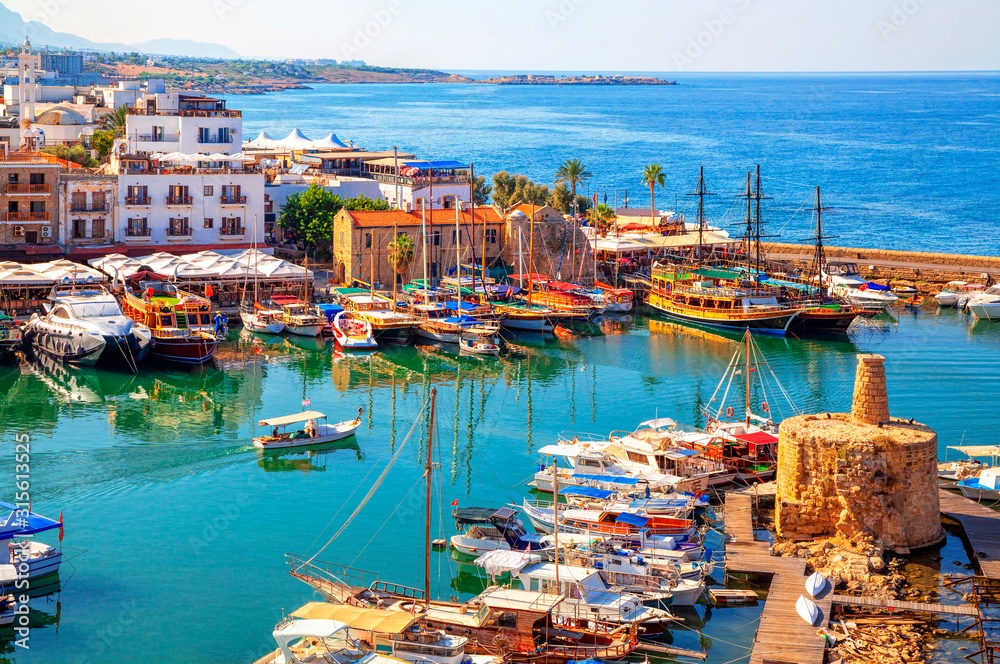 Panoramic view of Kyrenia (Girne) old harbour on the northern coast of Cyprus. Kyrenia seaside of Mediterranean Sea, Cyprus. Famous places and travel destination of Kyrenia, Cyprus