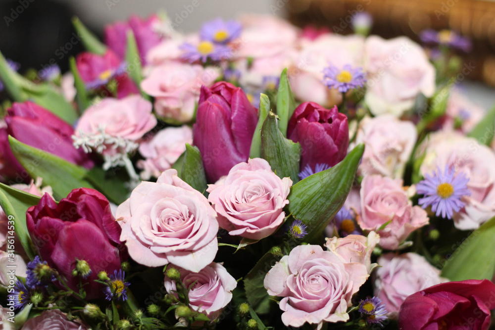 Bouquet of pink roses and tulips stock photo. Gift cards. Beautiful background flowers, roses and tulips. Greeting card, decoration for party.