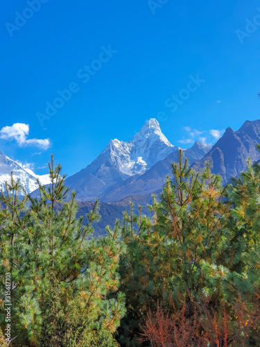 Everest base camp trek itinerary: way from Namche Bazar to Phortse Tanga, Solokhumbu, Nepal. Beautiful view on Ama Dablan and green valley, Himalayas. photo