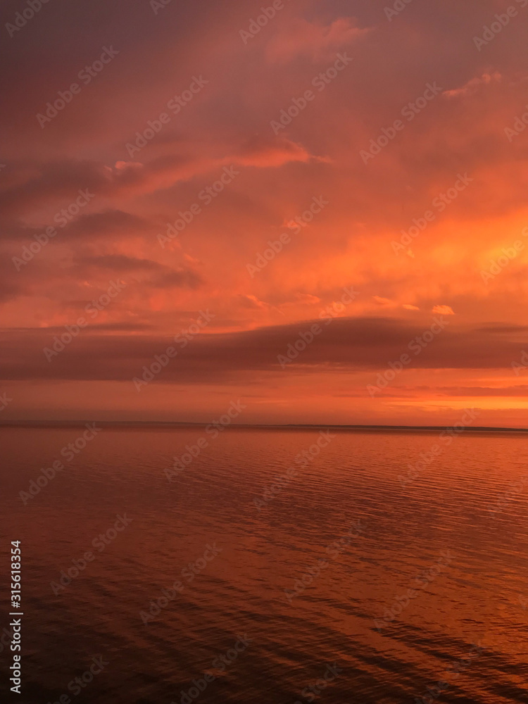 Red orange fire sunset at the sea