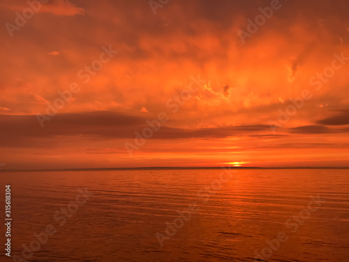 Red orange fire sunset at the sea © Oksana