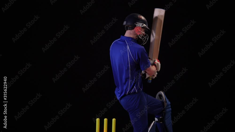 Cricket Batsman bowled out - Wicket. Black background. Dressed in blue. - Stock 4K Video Clip Footage Cricket Batsman bowled out - Wicket. Black background. Dressed in blue. - Stock 4K Video Clip Footage