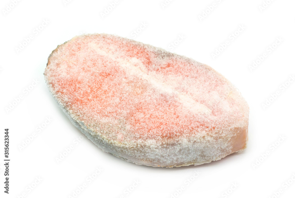 Frozen raw steak of atlantic salmon isolated on white background Frozen raw steak of atlantic salmon isolated on white background