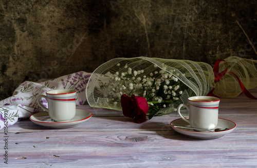 A cups of coffee and of rose