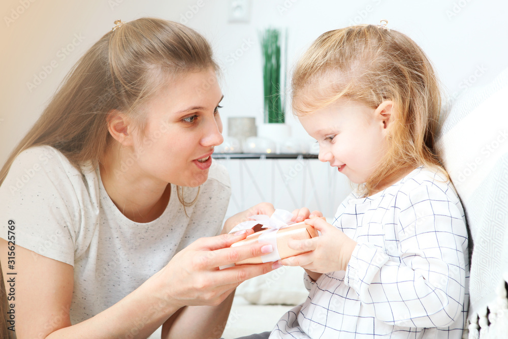 Mother's day concept. Mom and daughter at home