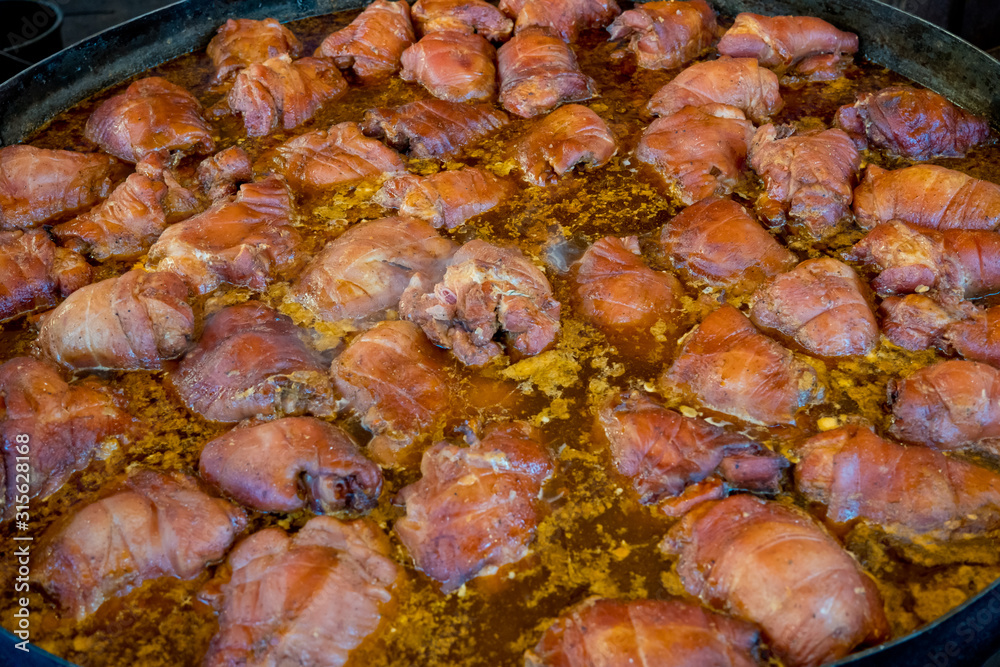 Pork knuckle in sauce. Close-up. Pork knuckle in sauce. Close-up.