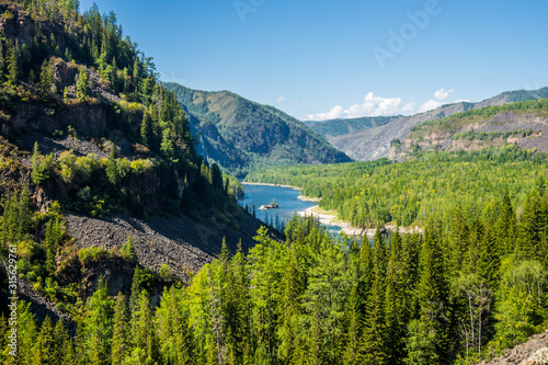Yenisei river source in Sayan mountains in sunny day. Siberia, Russia.