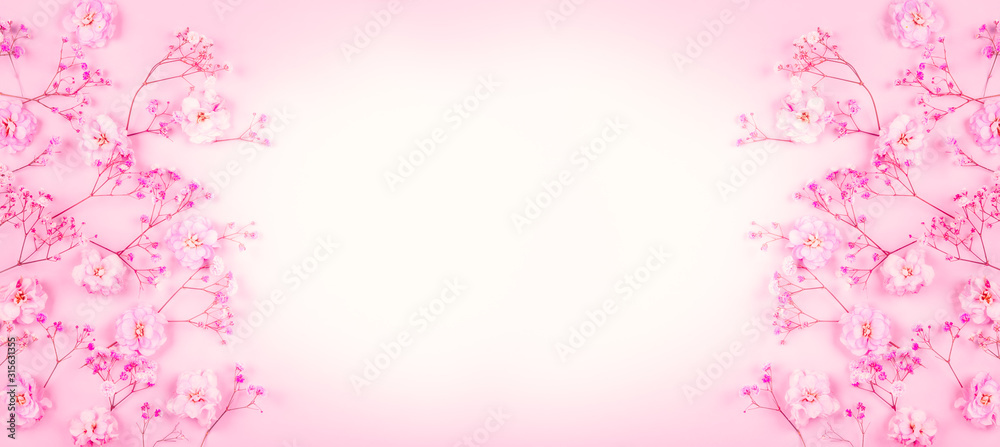 Spring floral composition made of fresh pink flowers on light pastel background Spring floral composition made of fresh pink flowers on light pastel background