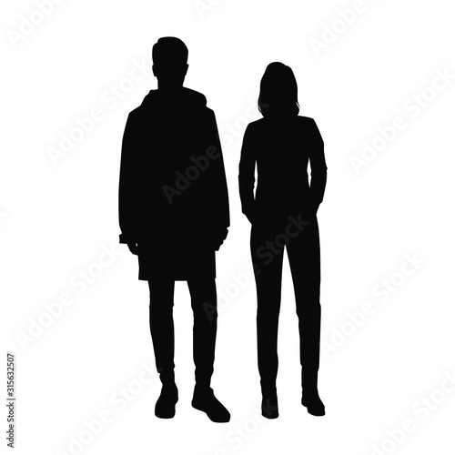 Vector silhouettes of  man and a woman, a couple of standing business people, black color isolated on white background