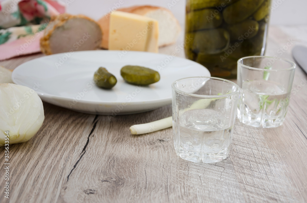 Cold Ukrainian grills with appetizers on a wooden table. Cold Ukrainian grills with appetizers on a wooden table.