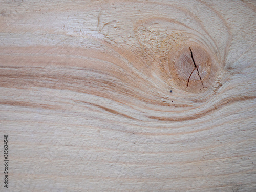 Bright wood texture. Texture background. Plank with knot.