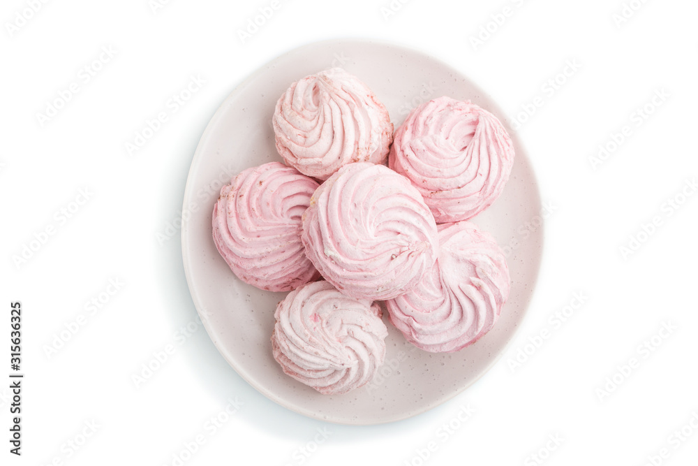 Pink strawberry homemade zephyr or marshmallow isolated on white background. top view. Pink strawberry homemade zephyr or marshmallow isolated on white background. top view.