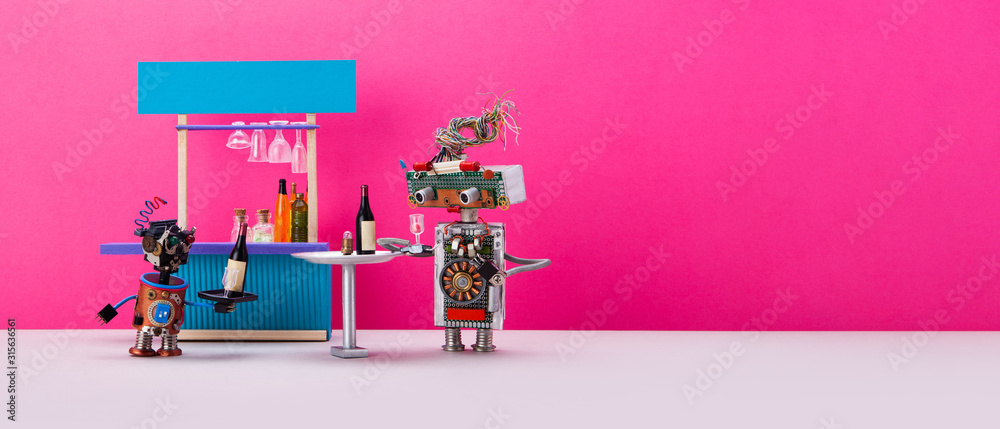 The waiter carries the order to the visitor of the bar. A funny little robot delivers a bottle of wine to a robotic guest at a pub. Bar counter and table on pink wall background. copy space for text