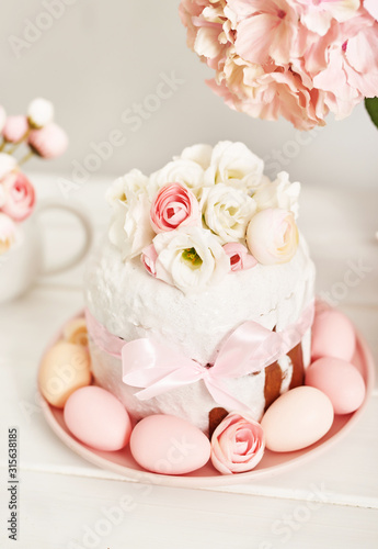 Easter orthodox sweet bread, kulich and colorful eggs with flowers. Holidays breakfast concept with copy space. Retro style. Easter greeting card template
