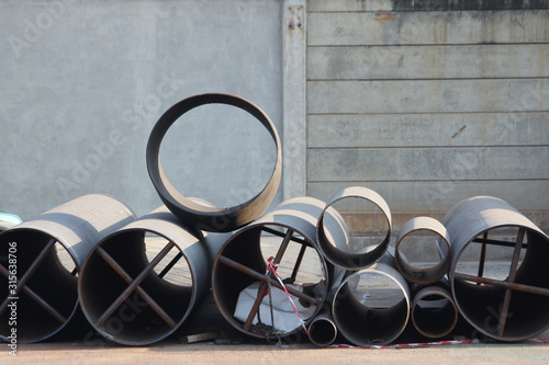Stack of new steel metal pipes. Industrial material.