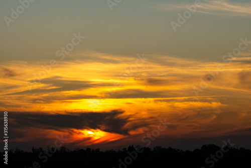 Sunset with Blur Clouds Background