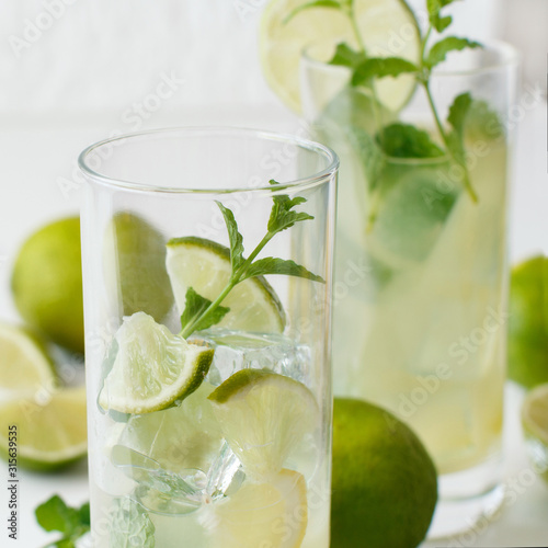 Homemade refreshing drink with lime juice and mint