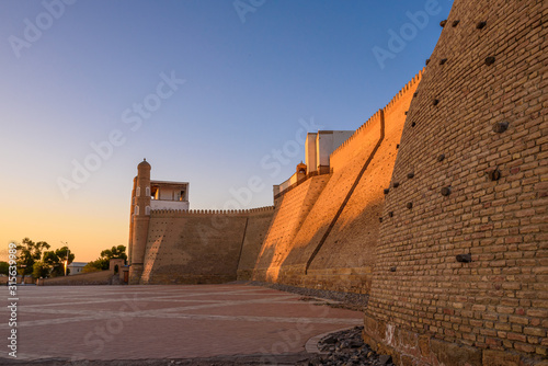 Ancient 12th century fortress Ark Citadel of Bukhara during sunset in Uzbekistan