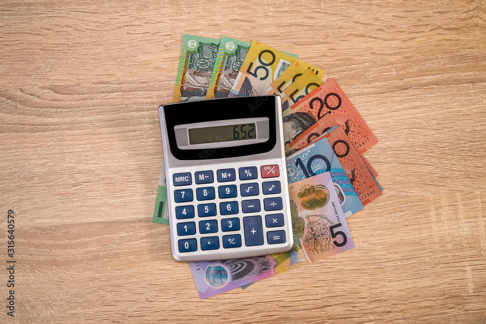 Australian money aud with calculator on desk. Australian money aud with calculator on desk.