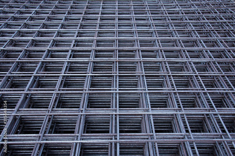 Steel bar iron wire in factory.Steel Rebars for reinforced concrete construction site.Steel reinforcement bar for industrial building Steel bar iron wire in factory.Steel Rebars for reinforced concrete construction site.Steel reinforcement bar for industrial building