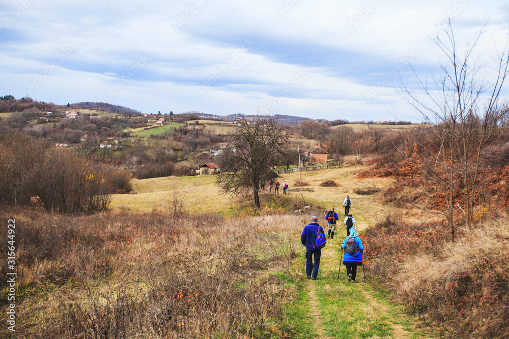 Hiking Group Of People Walking In Nature