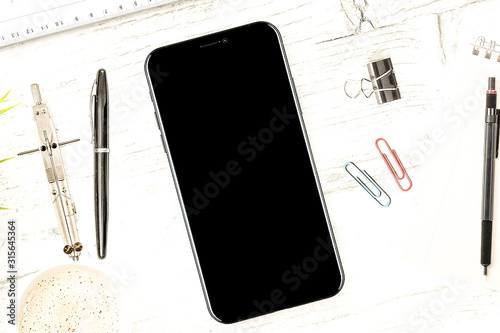 iPhone X on desk top view