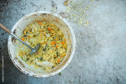 Rice or food in old containers, poor.