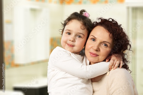 Beautiful smiling family on interior background