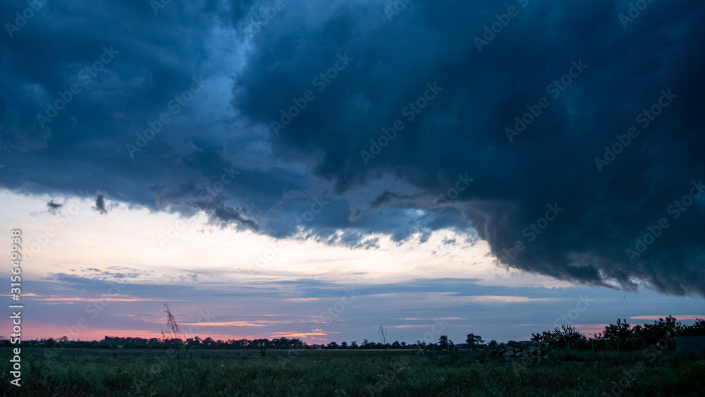 Dramatic Storm Clouds in Sunset. Climate Change and Global Warming Dramatic Storm Clouds in Sunset. Climate Change and Global Warming