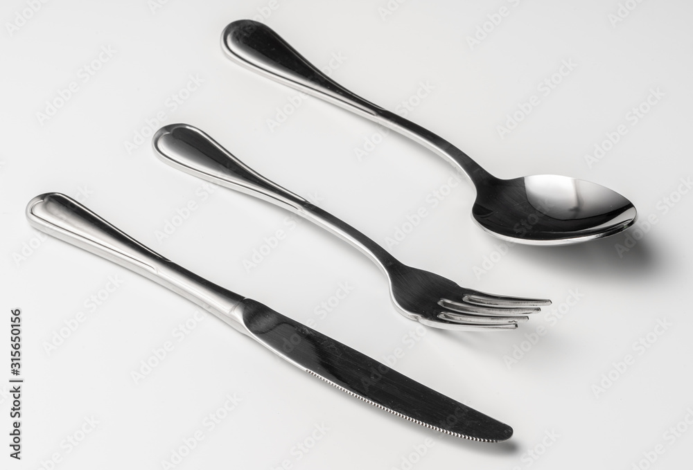 Spoon, fork and knife on a white background Spoon, fork and knife on a white background