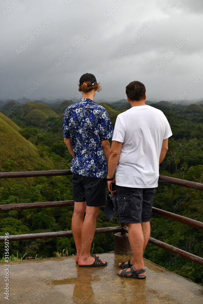 tourists admire the natural beauty of the chocolate hills on bohol island in the philippines