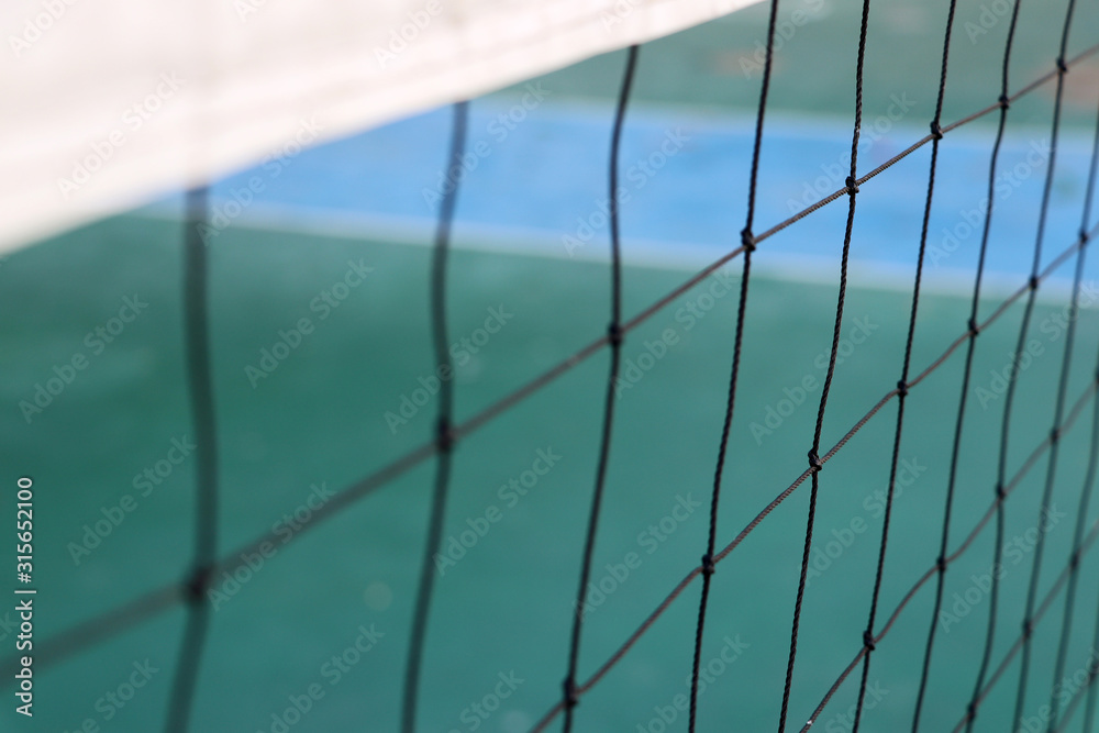 Sport net and white stripe on top with green floor background for play sports. Sport net and white stripe on top with green floor background for play sports.