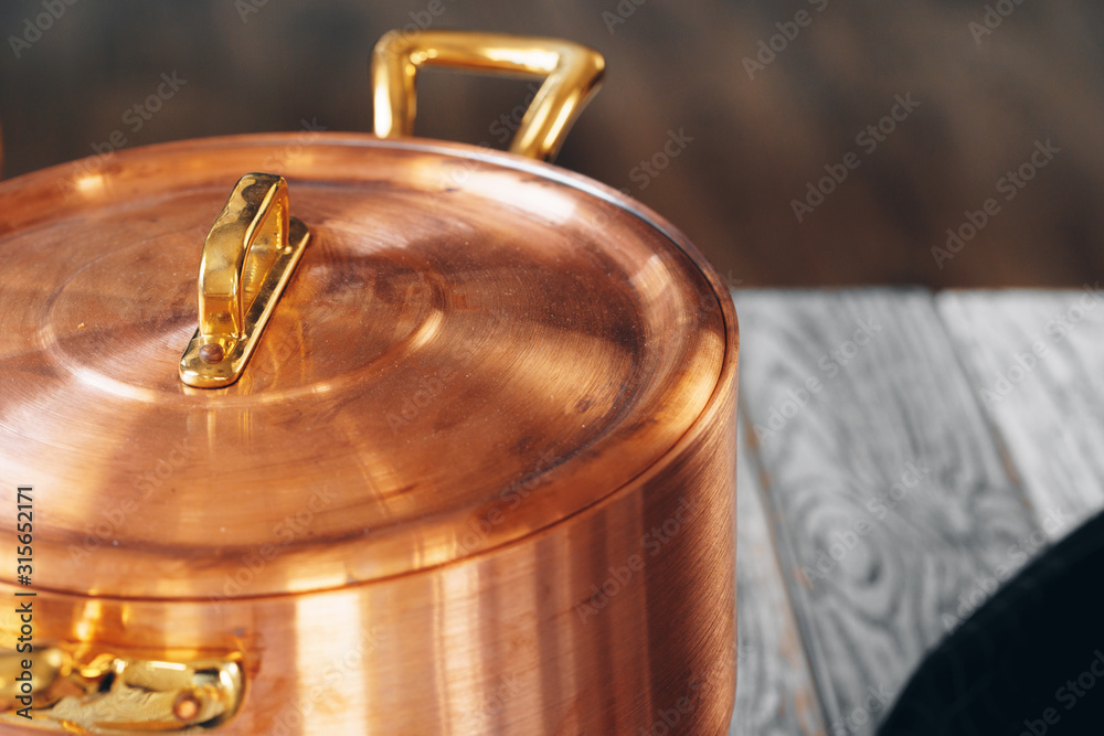 Close up of a set of copper cookware