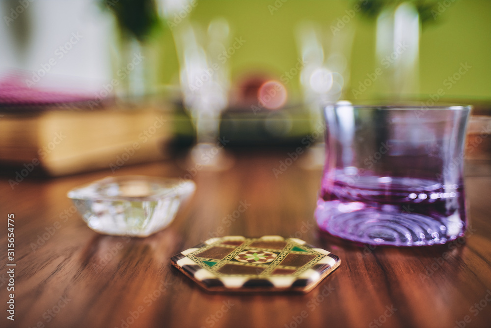 arabic coaster on a elegant wooden table arabic coaster on a elegant wooden table