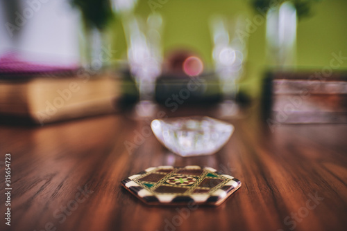 arabic coasters on a elegant wooden table © Sergio de Flore