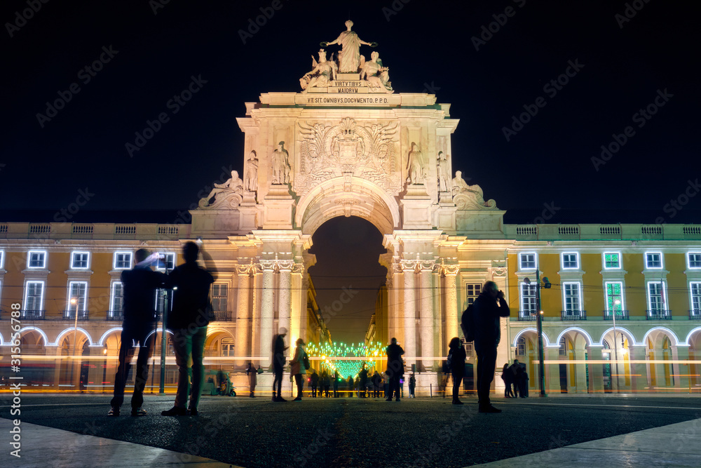The Rua Augusta Arch at night in Lisbon, Portugal.