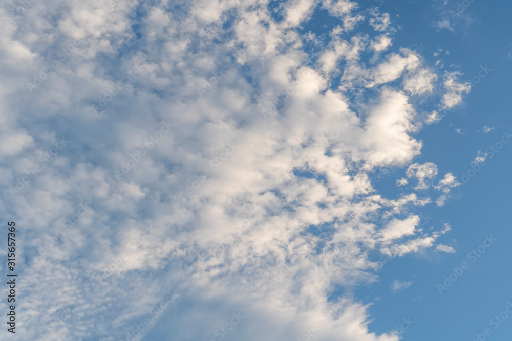 Beautiful clear blue sky with cirrus clouds. Bright positive natural background Beautiful clear blue sky with cirrus clouds. Bright positive natural background