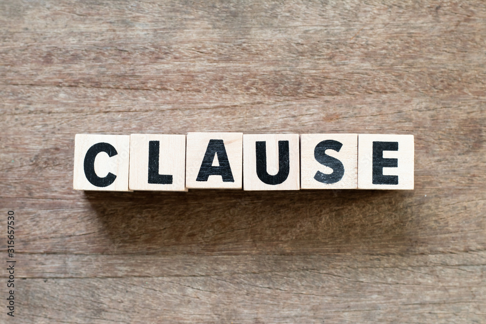 Letter block in word clause on wood background Letter block in word clause on wood background