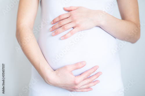 Wallpaper Mural young pregnant woman caressing her tummy Torontodigital.ca