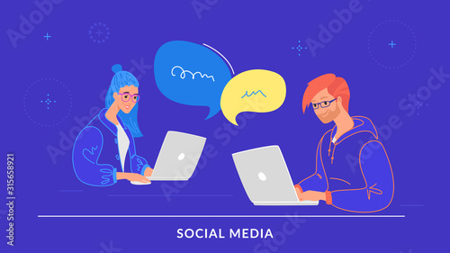 Young couple chatting together in social media using laptop at work desk