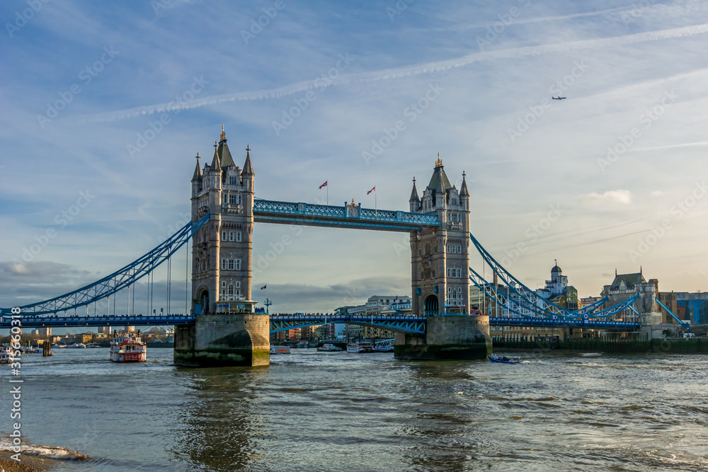 Tower Bridge in London, the UK - one of English symbols. Golden hour time with beautiful sky. 