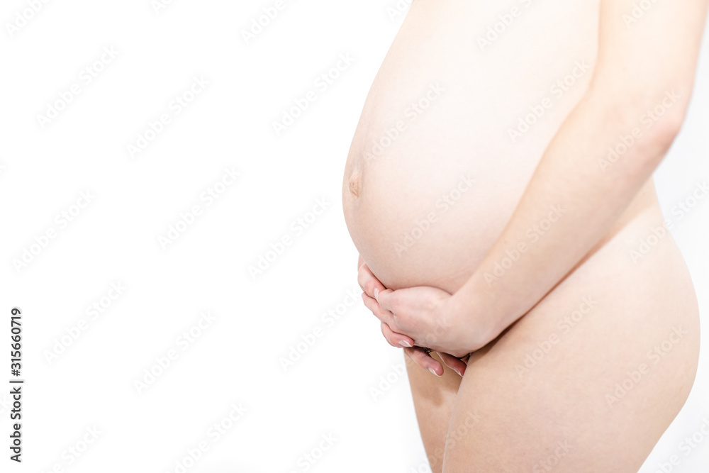 Young pregnant naked woman